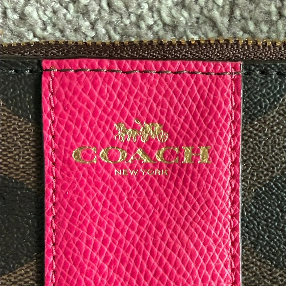 Coach Brown Signature Canvas Wristlet with Hot Pink Center Stripe